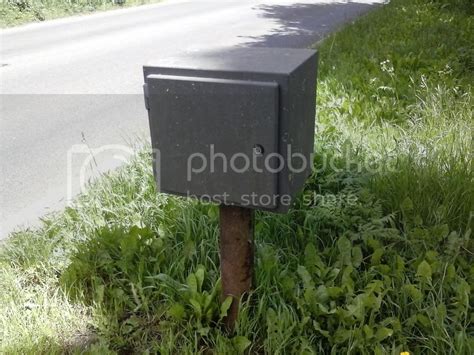 steel box on side of road|Small Grey Boxes on roadside .